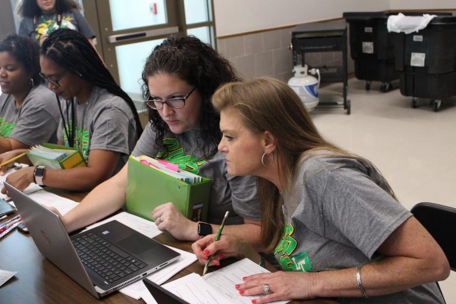Counselors review schedules during Freshman Stampede on Aug. 6 2019