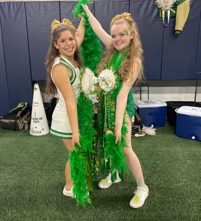Alyssa Mello and Chloe Glanville pose at the Homecoming game during the 2022-2023 school year.