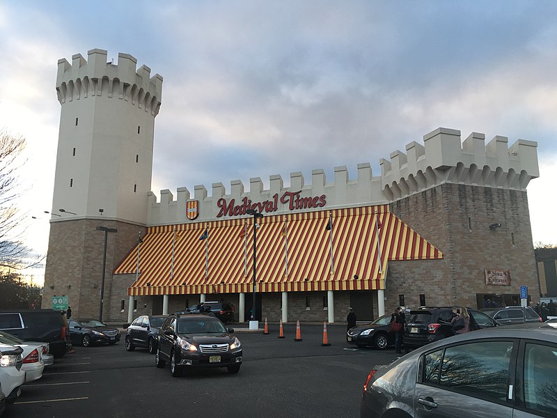 The exterior of Medieval Times on a cloudy day.

Photo Credit: AntiCompositeNumber, CC BY-SA 4.0 , via Wikimedia Commons