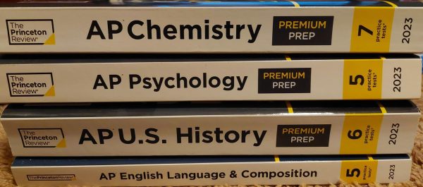 Stack of AP textbooks to guide exam preparations