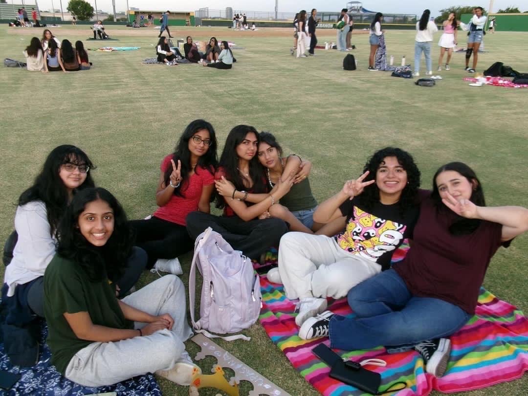 A group of senior girls enjoy senior sunrise 