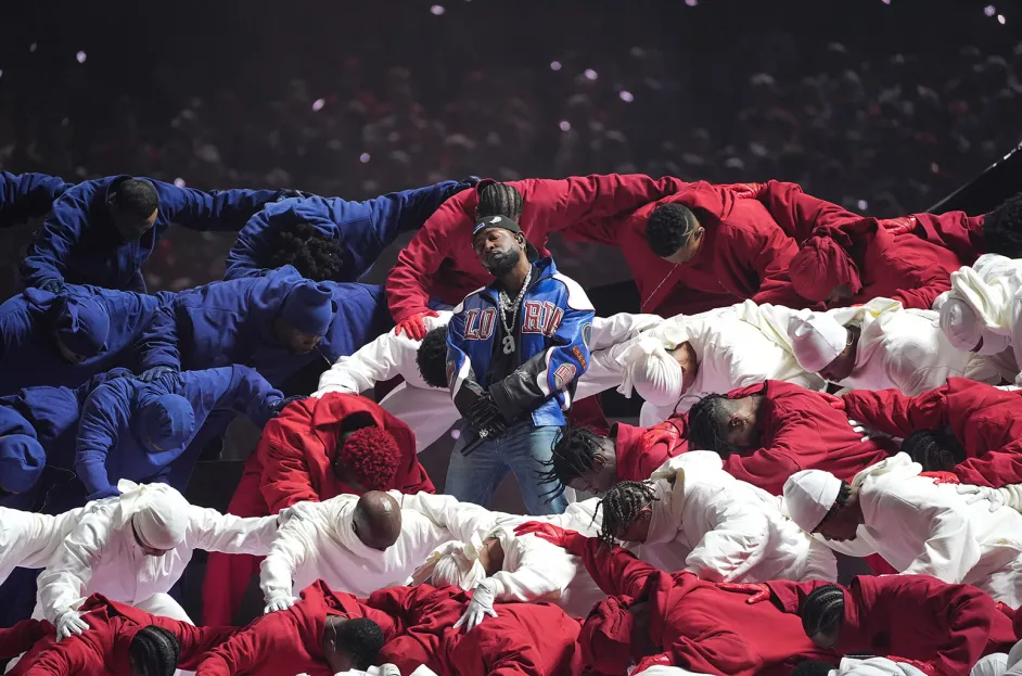 Kendrick Lamar Performs During Super Bowl Halftime 

Credit: A. Clary T. (2025). Kendrick Lamar Halftime [Photo]. AFP via Getty Images.